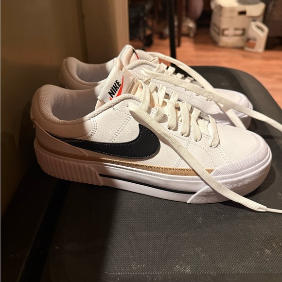 Nike Shoes - SOLD!!
NEW Women’s Nike White and Black Sneakers with Tan Accent